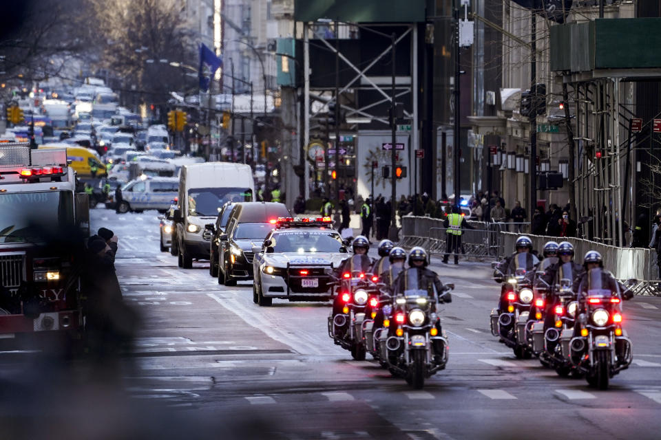 A hearse carrying the casket of New York City Police Officer Wilbert Mora arrives at St. Patrick's Cathedral for his wake, Tuesday, Feb. 1, 2022, in New York. Mora and Officer Jason Rivera were fatally wounded when a gunman ambushed them in an apartment as they responded to a family dispute. (AP Photo/John Minchillo)