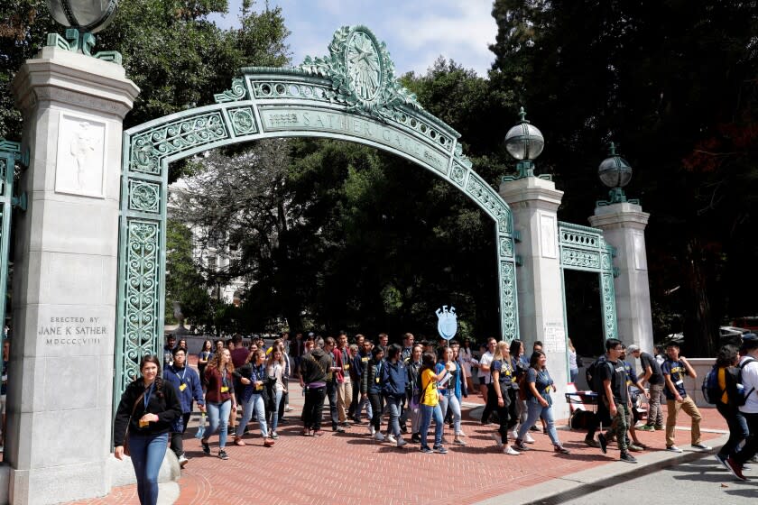 FILE - In this Aug. 15, 2017 file photo, students walk on the University of California, Berkeley campus in Berkeley, Calif. Top leaders at the University of California say they support dropping the SAT and ACT exams from admission requirement. UC Berkeley Chancellor Christ, along with the UC system's chief academic officer, said Friday, Nov. 22, 2019, that research has convinced them that performance on the tests is so strongly influenced by family income, parents' education and race, that using them for admissions decision is unfair. (AP Photo/Marcio Jose Sanchez, File)