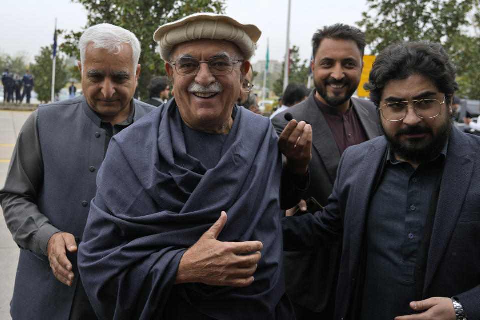 Mahmood Khan Achakzai, center, Pakistan's newly elected lawmaker from Pashtunkhwa Milli Awami Party, arrives to attend the opening session of parliament, in Islamabad, Pakistan, Thursday, Feb. 29, 2024. Pakistan's National Assembly swore in newly elected members on Thursday in a chaotic scene, as allies of jailed former Premier Khan protested what they claim was a rigged election. (AP Photo/Anjum Naveed)