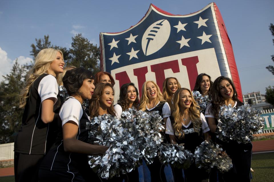 <p>Oakland Raiders cheerleaders pose for photos at an NFL-sponsored event promoting physical activity in Mexico City, Friday, Nov. 18, 2016. The NFL’s Play 60 campaign encourages children to be active 60 minutes a day to avoid childhood obesity. The Raiders play the Houston Texans on Monday. (AP Photo/Rebecca Blackwell) </p>