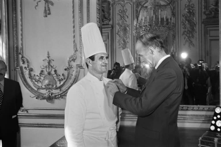 Top French chef Paul Bocuse is awarded the French Legion d'honneur by President Valery Giscard d'Estaing in 1975