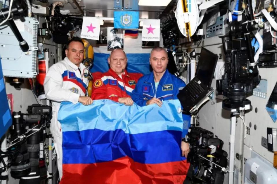 NASA accused Russia of staging an anti-Ukrainian propaganda photo on the ISS after Russia’s space agency posted this photo of three cosmonauts holding a flag of the Luhansk People’s Republic. <a href="https://t.me/roscosmos_gk/5556" rel="nofollow noopener" target="_blank" data-ylk="slk:Roscosmos via Telegram;elm:context_link;itc:0;sec:content-canvas" class="link ">Roscosmos via Telegram</a>