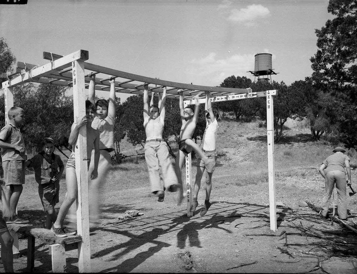 July 4, 1943: Pittman Mauldin and Charles Bowman of Fort Worth, and Bill Lynch of Weatherford, cross the hand-walk ladders at Worth Ranch Boy Scout Camp. Fort Worth Star-Telegram archive/UT Arlington Special Collections