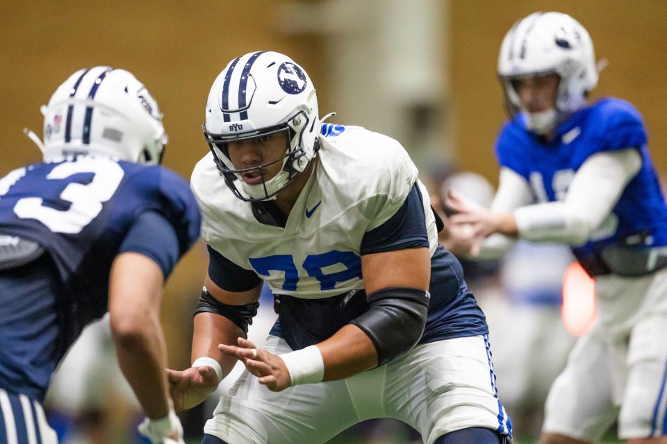 BYU offensive lineman Kingsley Suamataia prepares to block during spring practice at the Indoor Practice Facility in Provo.