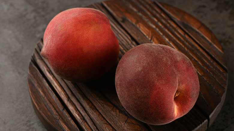 Large red peaches on board