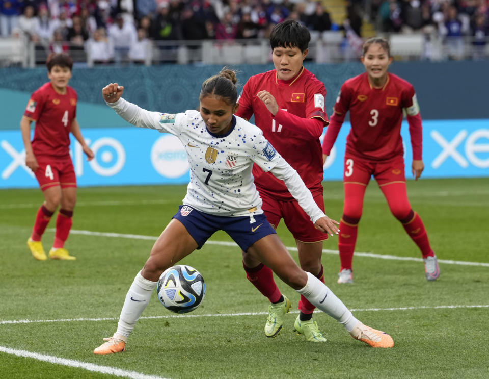 United States' Alyssa Thompson (7) shields the ball from Vietnam's Thi Thu Thao Tran during the Women's World Cup Group E soccer match between the United States and Vietnam at Eden Park in Auckland, New Zealand, Saturday, July 22, 2023. (AP Photo/Abbie Parr)