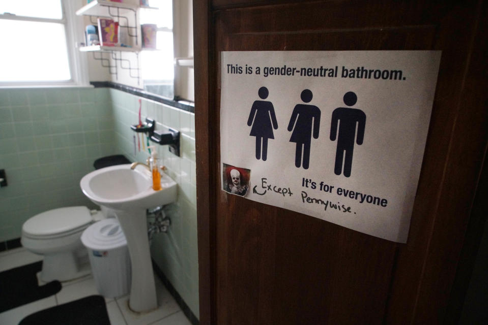 A transgender friendly sign hangs outside of the master bathroom that 13-year-old Trinity Neal's family uses.