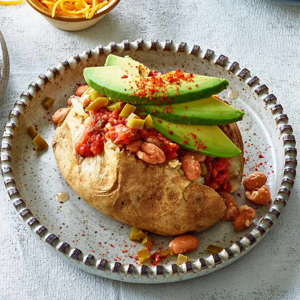 <p>Taco night meets baked potato night with this simple recipe for loaded baked potatoes with salsa, beans and avocado. This easy, healthy family dinner comes together with just 10 minutes of active time, so you can make it on even the busiest of weeknights. This recipe is just as delicious with sweet potatoes in place of russets. <a href="https://www.eatingwell.com/recipe/275783/stuffed-potatoes-with-salsa-beans/" rel="nofollow noopener" target="_blank" data-ylk="slk:View Recipe;elm:context_link;itc:0;sec:content-canvas" class="link ">View Recipe</a></p>