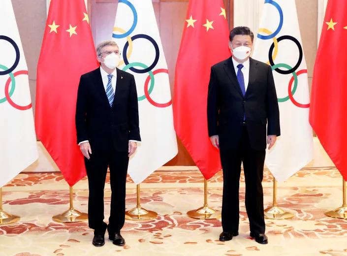 In this photo released by China&#39;s Xinhua News Agency, International Olympic Committee (IOC) President Thomas Bach, left, and Chinese President Xi Jinping meet at the Diaoyutai State Guesthouse in Beijing on Jan. 25, 2022.