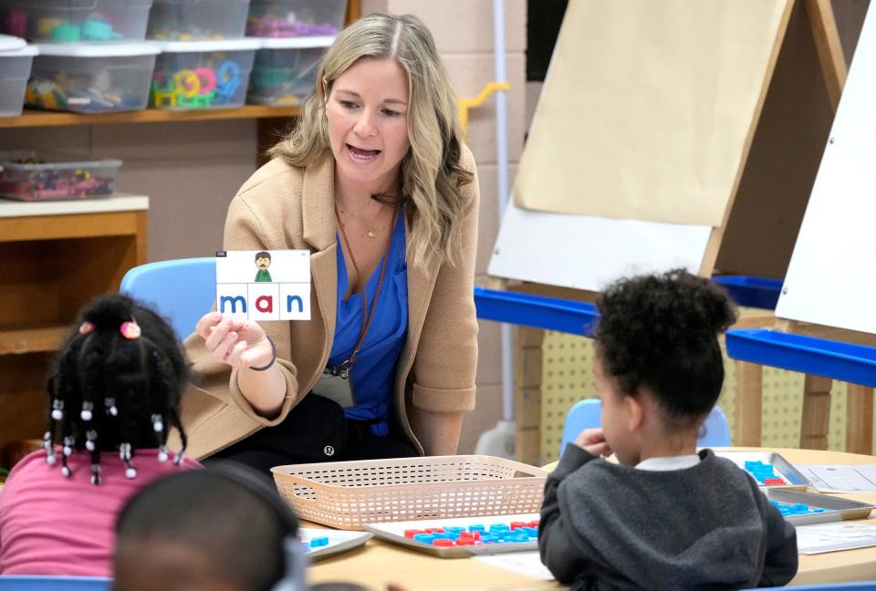 Hawthorne School K-4 teacher Jessica Kovacovich works with students on a reading and spelling lesson.