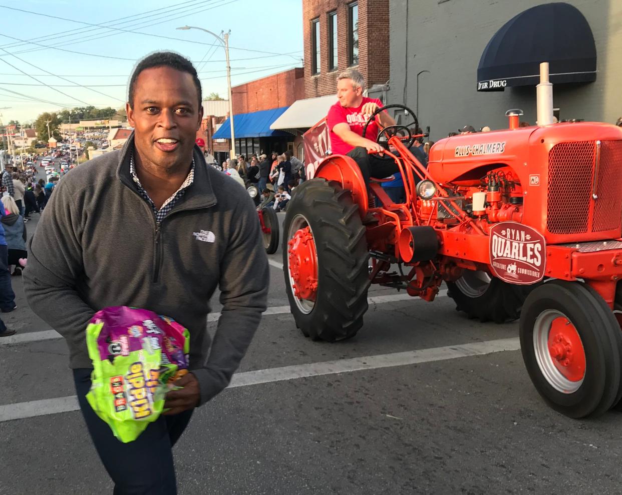 Attorney general candidate Daniel Cameron campaigns with Agriculture Commissioner Ryan Quarles in the 40th Foothills Festival parade in Albany on Oct. 18.