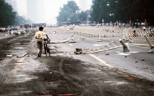 Aftermath: Changan Avenue, crushed by Chinese Army tanks during the night of violence in and around Tiananmen Square - Peter Charlesworth