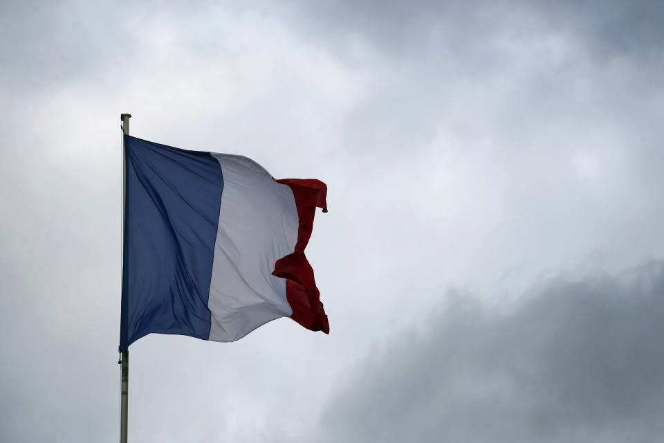 The French flag on top of the Elysee Palace is flapping in the sky after a meeting with French President Emmanuel Macron and local, national political leaders, unions, business leaders and others to hear their concerns after four weeks of protests, at the Elysee Palace in Paris, Monday, Dec. 10, 2018. French President Emmanuel Macron is preparing to speak to the nation at last after increasingly violent "yellow vest" protests against his leadership. (AP Photo/Francois Mori)