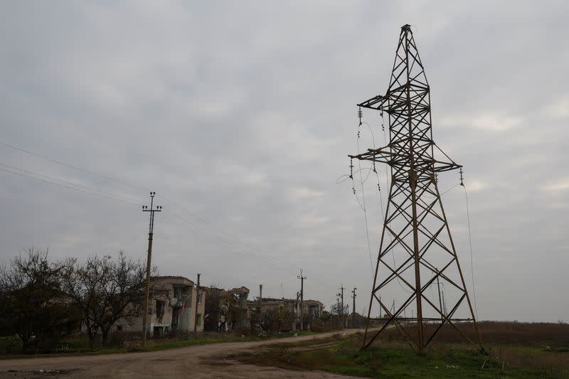 Views shows houses and a pylon with high-voltage wires damaged during Russian military attacks in the village of Osokorivka, in Kherson region