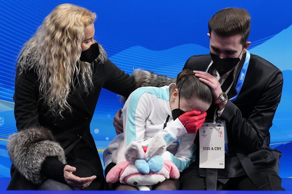 Kamila Valieva, of the Russian Olympic Committee, reacts after competing in the women's free skate program during the figure skating competition at the 2022 Winter Olympics, Thursday, Feb. 17, 2022, in Beijing. (AP Photo/David J. Phillip)