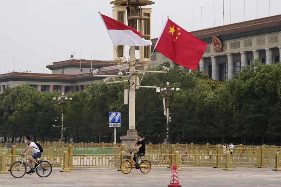 The Indonesian and Chinese national flags are flown together near the Great Hall of the People in Beijing, Monday, July 25, 2022. Indonesian President Joko Widodo was heading to Beijing on Monday for a rare visit by a foreign leader under China's strict COVID-19 protocols and ahead of what could be the first overseas trip by Chinese President Xi Jinping since the start of the pandemic more than two years ago. (AP Photo/Ng Han Guan)