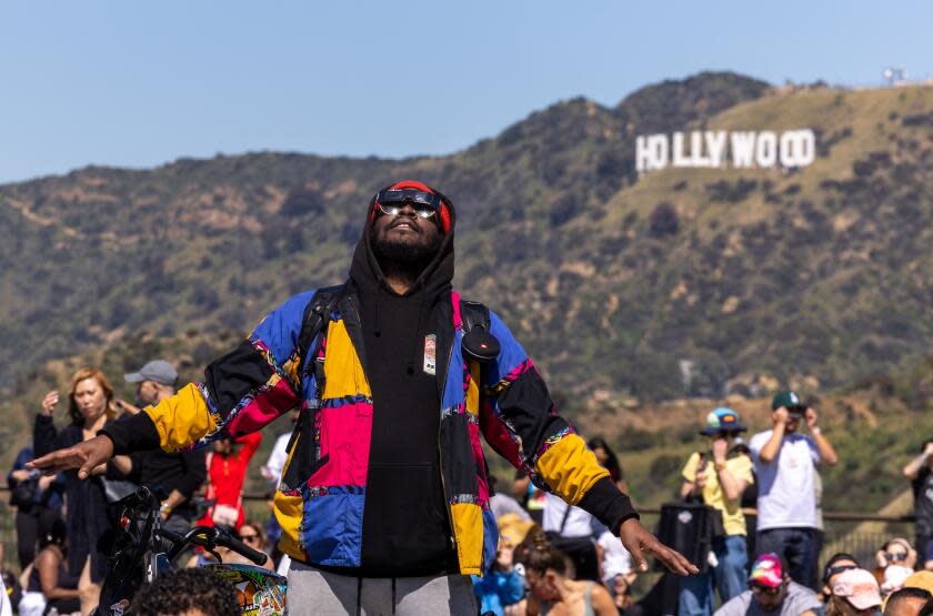 Los Angeles, CA - April 08: Duke Brobby watches the solar eclipse at Griffith Observatory on Monday, April 8, 2024 in Los Angeles, CA. (Brian van der Brug / Los Angeles Times)