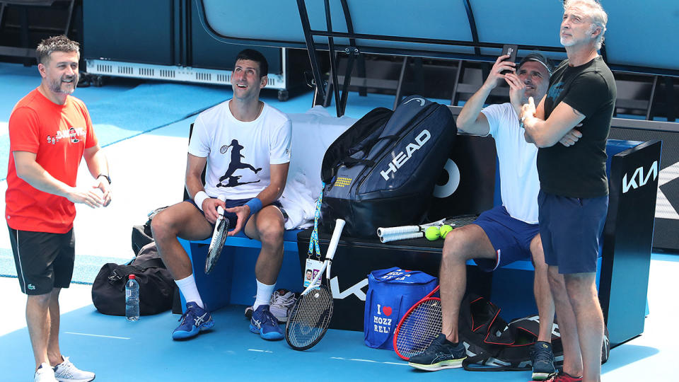 Novak Djokovic, pictured here speaking with his team during a training session in Melbourne ahead of the Australian Open.