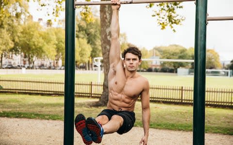 Max Lowery exercises in a park - Credit: Tom Joy