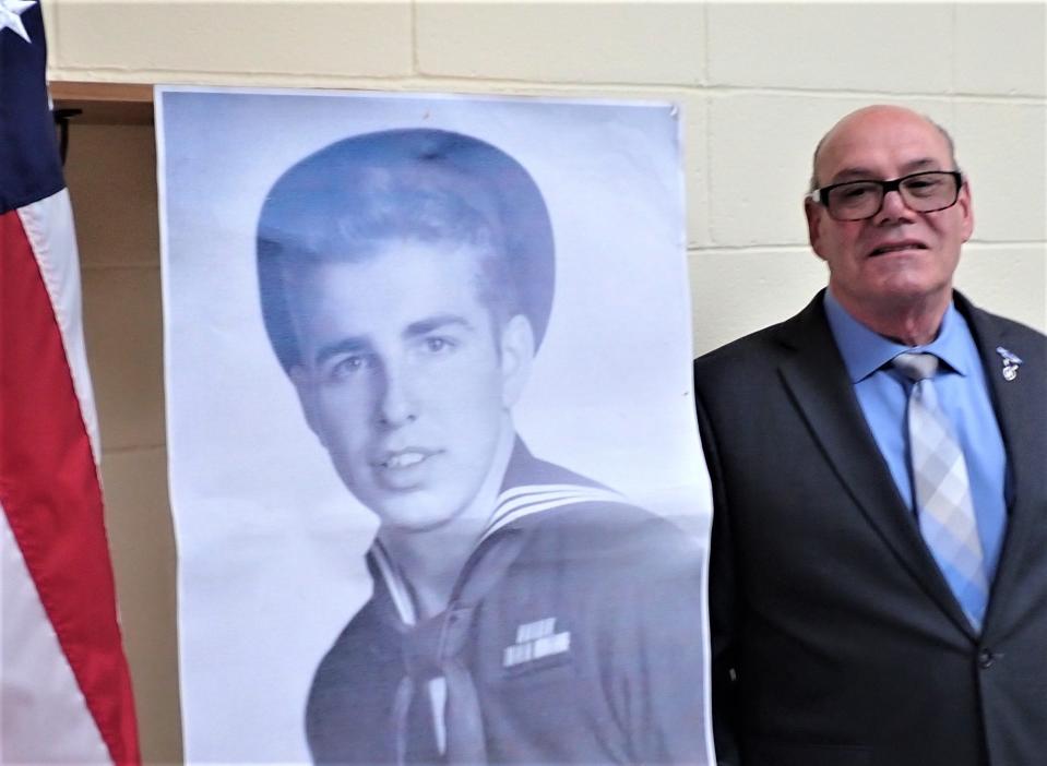 Vietnam Veteran and Purple Heart recipient Carmen Turrisi Jr., right, poses with a World War II photo of Cornelius Neal Faber. Turisi, 77, of East Hanover, and Faber, 99, a resident of a local nursing home, were selected to be grand marshals of Monday's Newton Memorial Day Parade. Faber, who built and ran Hampton Roller Rink, is presently confined to a medical unit at the home. The parade steps off on Spring Street at 10 a.m. and ends with a memorial ceremony in Memory Park.