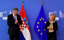 European Commission President Ursula von der Leyen, right, welcomes Croatian Prime Minister Andrej Plenkovic prior to a meeting at EU headquarters in Brussels, Thursday, July 16, 2020. (John Thys, Pool Photo via AP)
