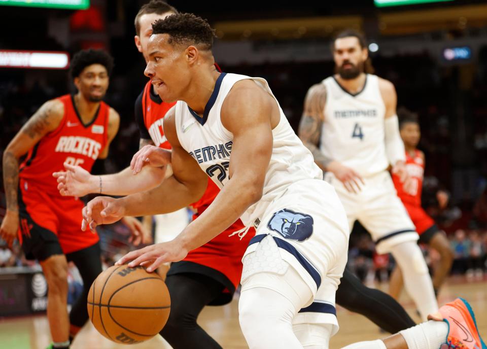 Mar 20, 2022; Houston, Texas, USA; Memphis Grizzlies guard Desmond Bane (22) drives with the ball during the first quarter against the Houston Rockets at Toyota Center. Mandatory Credit: Troy Taormina-USA TODAY Sports