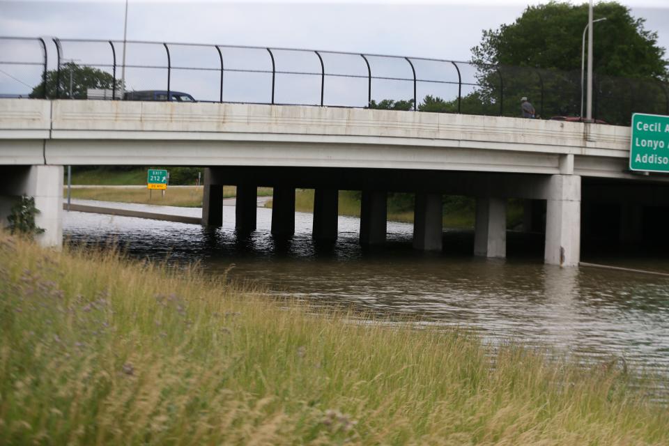 Floodwaters block sections of Interstate 94 near the Livernois Avenue exit in Detroit.