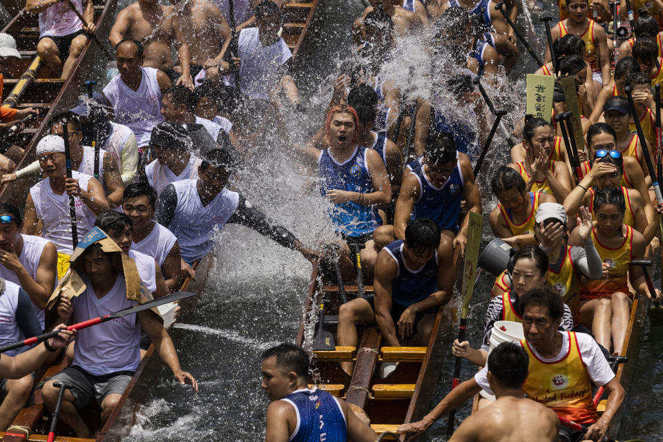 Competitors take part in the annual dragon boat race to celebrate the Tuen Ng festival in Hong Kong, Thursday, June 22, 2023. (AP Photo/Louise Delmotte)