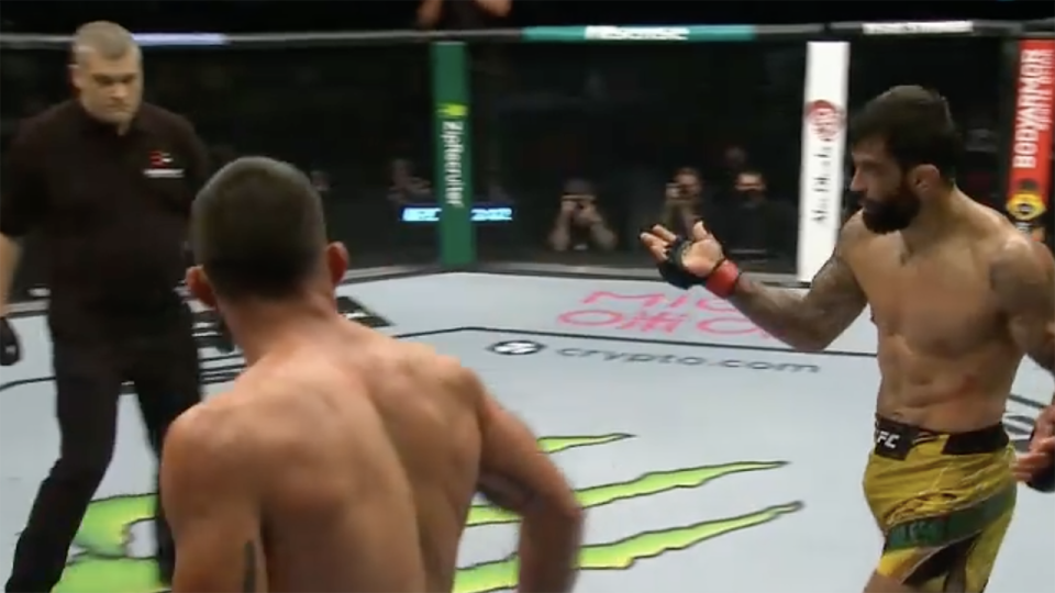 Elizeu Dos Santos beckons the referee to stop his fight against Benoit Saint-Denis at UFC 267.