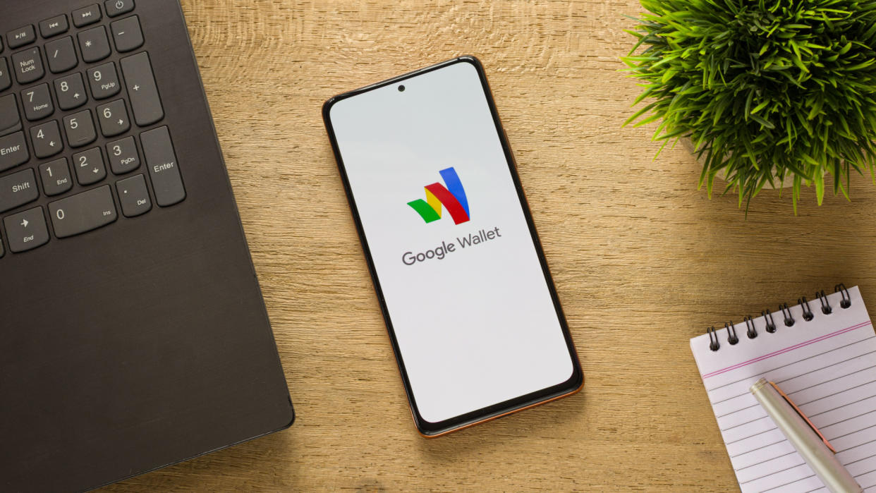  A phone with the google wallet logo on it. 