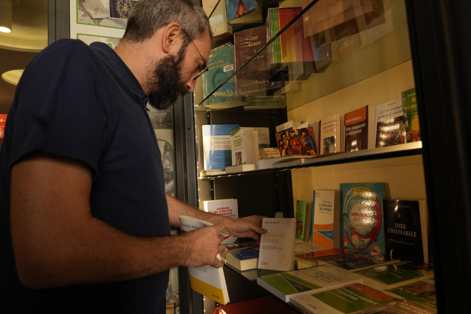 Copies of Pope Francis' latest encyclical letter on environment "Laudate Deum" are prepared for sale in a bookshop in Rome, Wednesday, Oct. 4, 2023. Pope Francis shamed and challenged world leaders on Wednesday to commit to binding targets to slow climate change before it's too late, warning that God's increasingly warming creation is fast reaching a "point of no return." (AP Photo/Andrew Medichini)