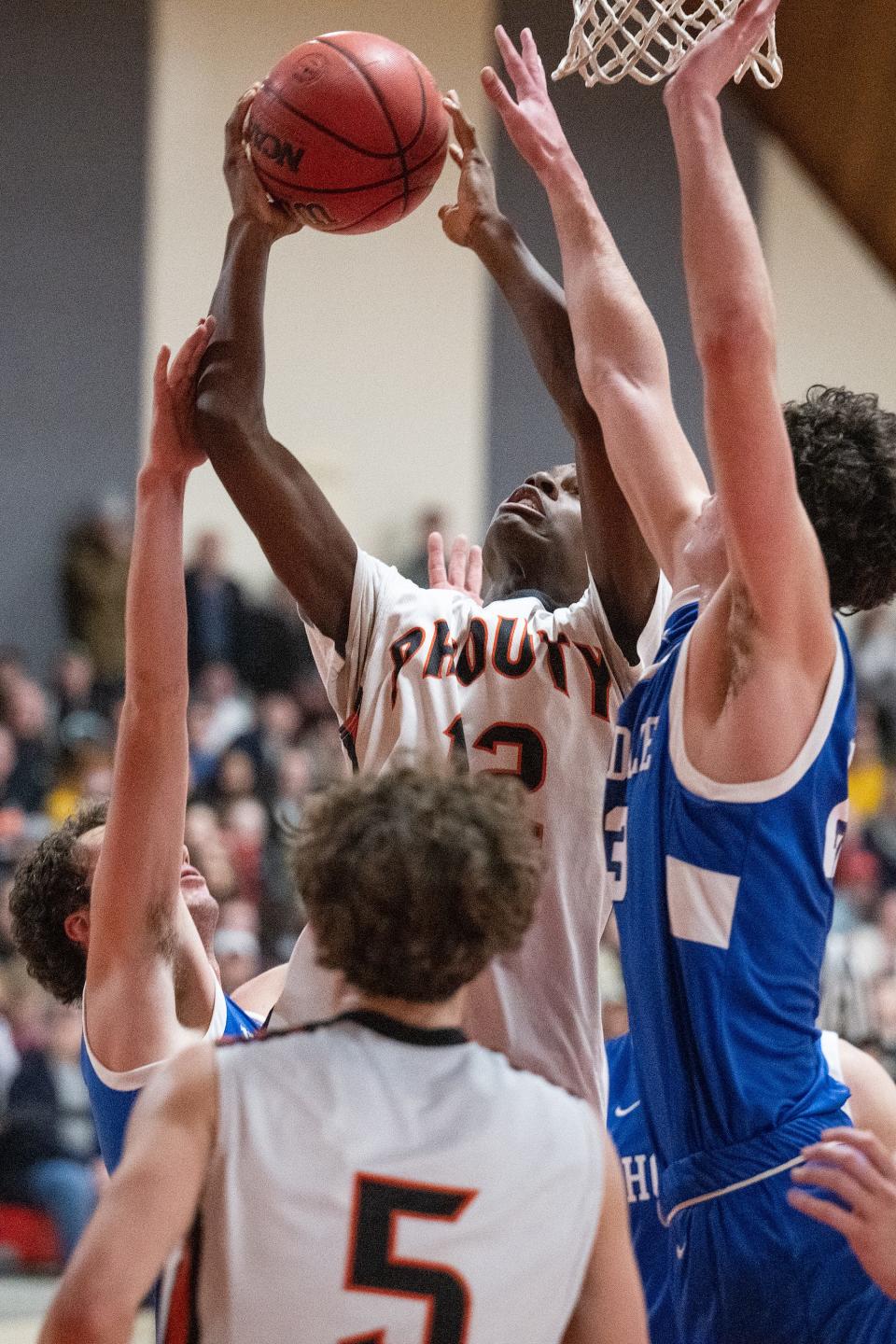 David Prouty's Judelius Neiray makes a shot to take the lead over Hopedale, 51-49, in the second overtime.