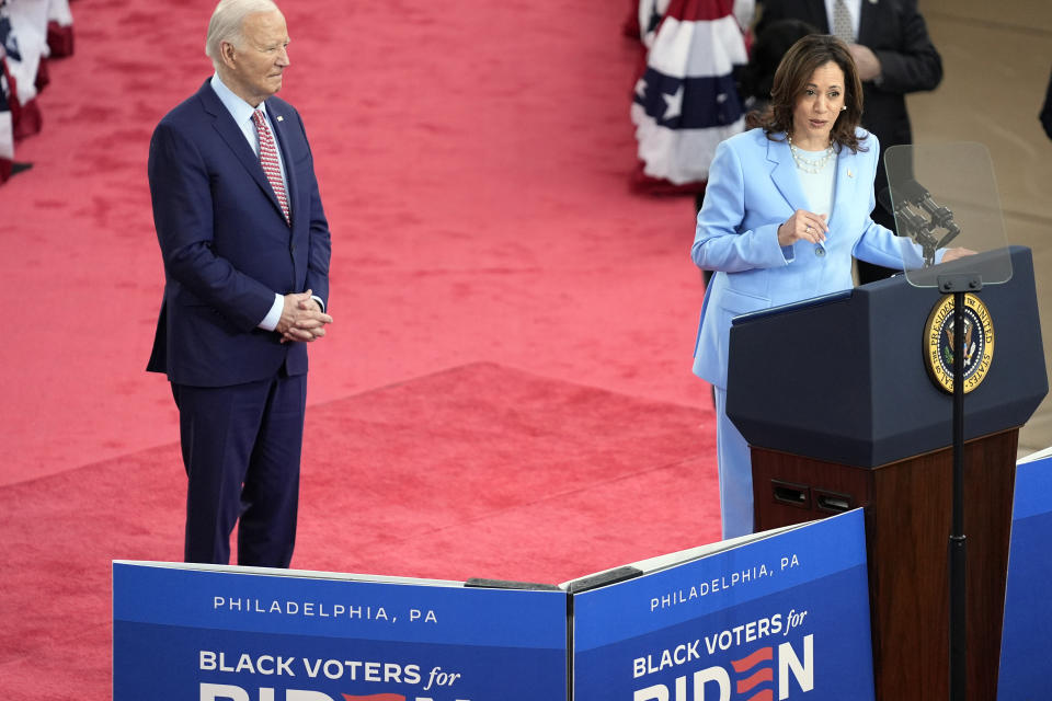 President Joe Biden listens as Vice President Kamala Harris speaks during a campaign event at Girard College, Wednesday, May 29, 2024, in Philadelphia. (AP Photo/Evan Vucci)