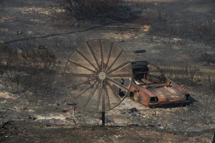 The remains of a destroyed home after the Blue Cut Fire passed through a rural community near Wrightwood, California (AFP Photo/Robyn Beck)