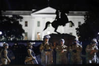 A line of DC National Guard members stand in Lafayette Park as demonstrators gather to protest the death of George Floyd, Tuesday, June 2, 2020, near the White House in Washington. Floyd died after being restrained by Minneapolis police officers. (AP Photo/Alex Brandon)