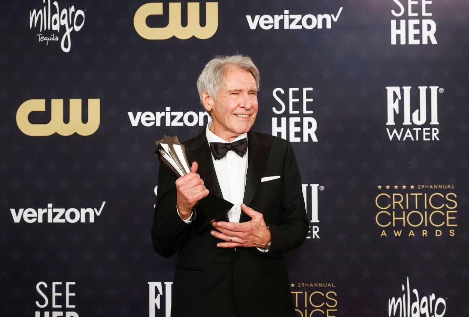harrison ford with his career achievement award at the critics choice awards 2024