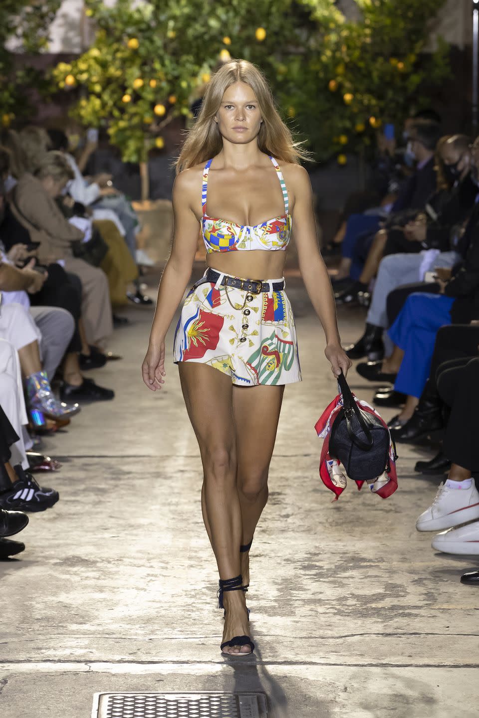 <p>You can practically feel the sea breeze coming off of Veronica Etro’s designs for spring 2021 inspired by a holiday on the Amalfi Coast—think Elizabeth Taylor sunning herself on Capri or Positano in the 1960s. She surely would surely have been a fan of the playful, playful aquatic prints that swam their way across on triangle bikini and bandeau tops, paired with everything from tailored shorts and pristine white trousers to all skirts. The accessories—gladiator sandals, straw hats, and gold rope chokers—also gave a La Dolce Vita vibe. —<em>Barry Samaha</em></p>