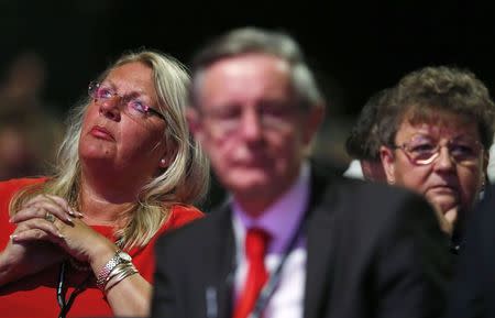 Delegates listen to a speaker during the Labour Party's annual conference in Manchester, northern England September 23, 2014. REUTERS/Suzanne Plunkett