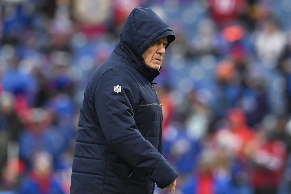 New England Patriots head coach Bill Belichick watches warm ups before an NFL football game against the Buffalo Bills in Orchard Park, N.Y., Sunday, Dec. 31, 2023. (AP Photo/Adrian Kraus)