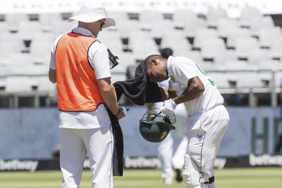 South African batsman Keegan Peterson takes well needed drinks break during the second day of the third and final test match between South Africa and India in Cape Town, South Africa, Wednesday, Jan. 12, 2022. (AP Photo/Halden Krog)