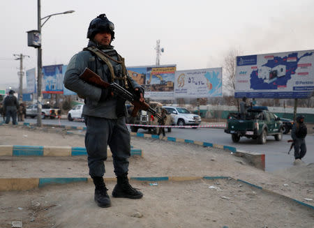Afghan policemen arrive at the site of an attack in Kabul, Afghanistan December 24, 2018. REUTERS/Omar Sobhani