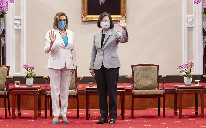 Speaker Nancy Pelosi (D-Calif.) and Taiwanese President Tsai Ing-wen wave during a meeting