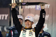 AJ Allmendinger holds up the winner's sword after a NASCAR Xfinity Series auto race at Bristol Motor Speedway Friday, Sept. 17, 2021, in Bristol, Tenn. (AP Photo/Mark Humphrey)