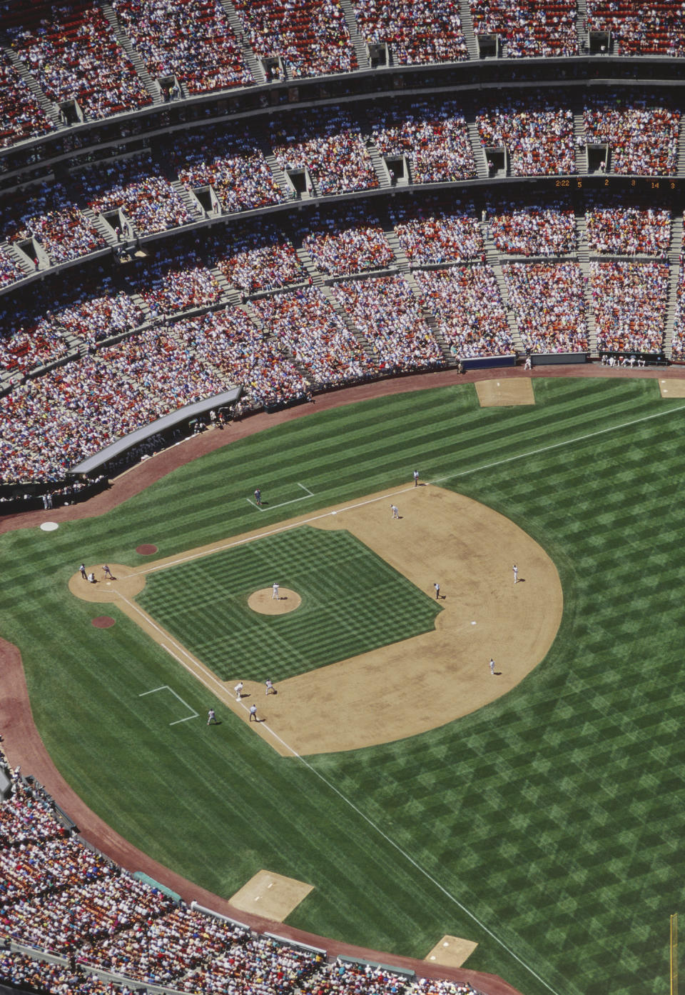 Aerial view of a baseball game in progress at a packed stadium