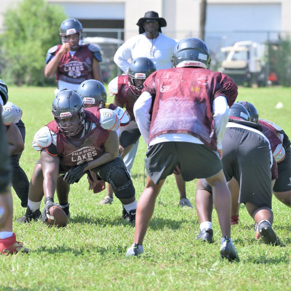 New Palm Beach Lakes head coach Turmarian Moreland gets ready to blow the whistle to start action during a practice on Aug. 11, 2023.