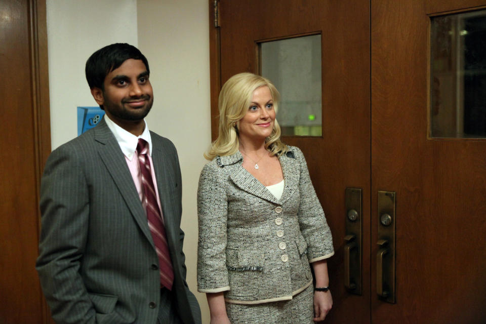 PARKS AND RECREATION, (from left): Aziz Ansari, Amy Poehler, 'Pilot', (Season 1, ep. 101, aired April 9, 2009), 2009-. photo: Mitch Haddad / © NBC / Courtesy Everett Collection