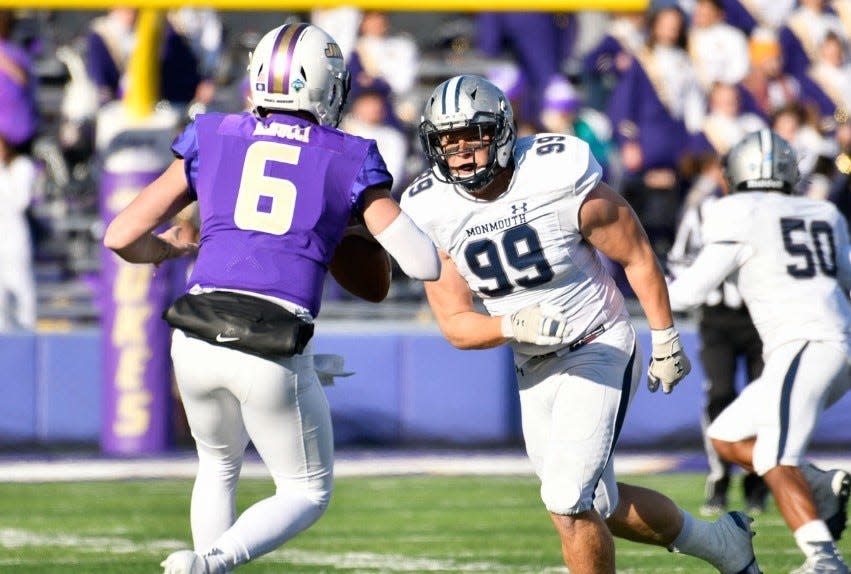 Monmouth defensive end Nick Shoemaker (99) rushes against James Madison quarterback Ben DiNucci (6) during an FCS Playoff game in Harrisonburg, Virginia on Dec. 7, 2019.