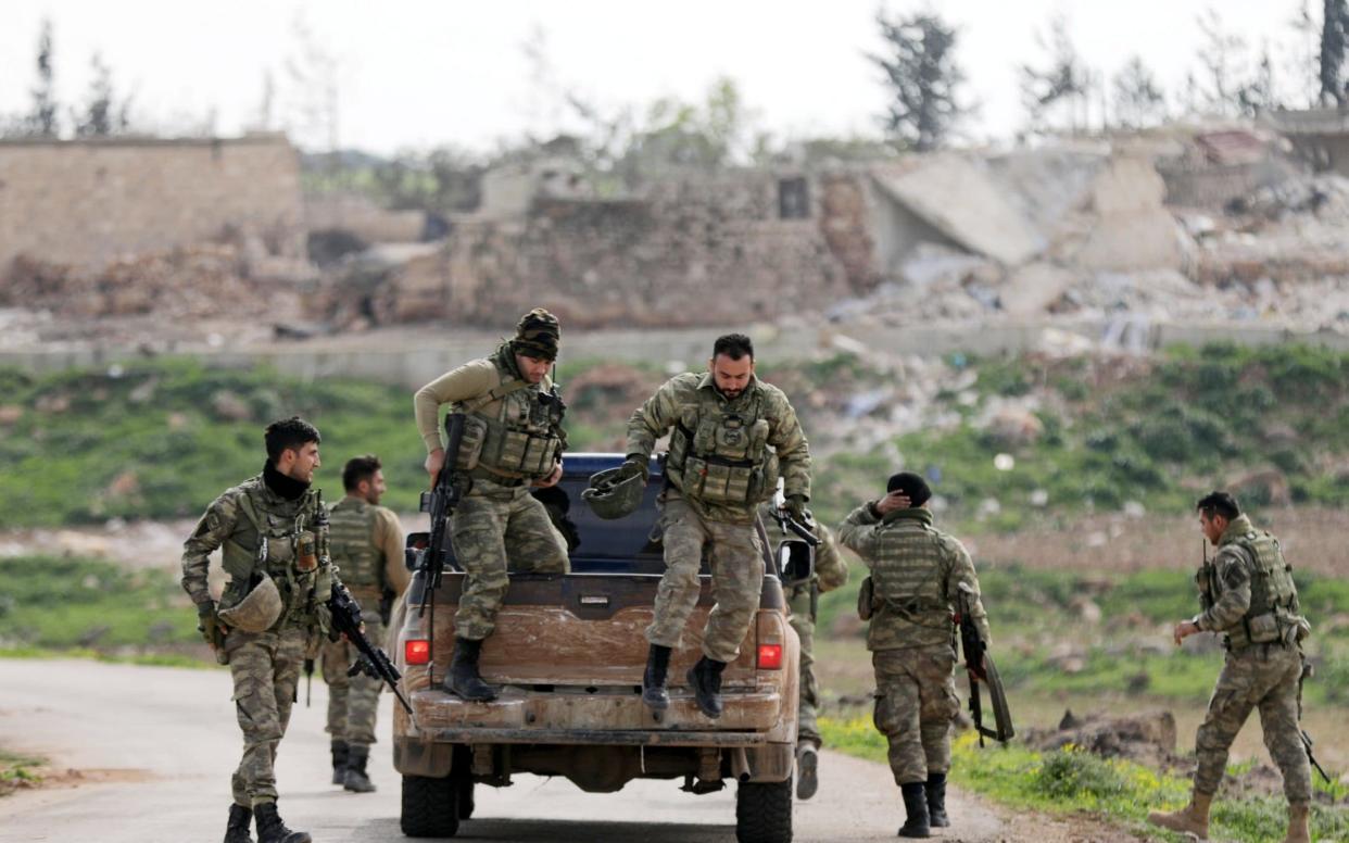 Turkish-backed Free Syrian Army fighters are seen in Maryamayn in eastern Afrin - REUTERS