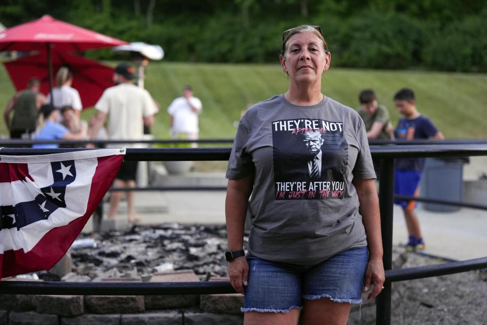 Renee Stayton, of Okeana, Ohio, poses for a portrait during a watch party for the U.S. presidential debate between former President Donald Trump and President Joe Biden, Thursday, June 27, 2024, in Hamilton, Ohio. For Stayton, the border is the biggest issue in this election. "They're bringing in the worst of the worst," Stayton said. "So many kidnappings are happening these days. I worry about that." (AP Photo/Joshua A. Bickel)