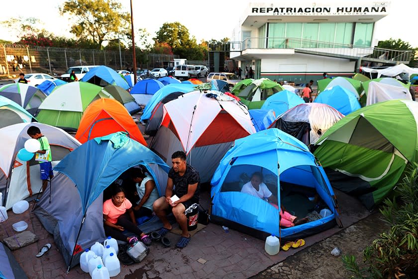 Migrants from Central America and Mexico await the outcome of their U.S. immigration court cases in a tent encampment near the Gateway International Bridge at the U.S.-Mexico border in Matamoros, Tamaulipas, in 2019.